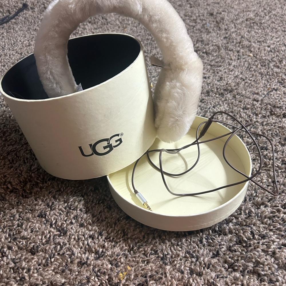 UGG cream colored, fuzzy earmuffs and headphones w/stereo jack. In original box